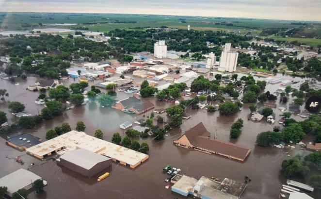  aerial view of flooding showing buildings and churches in water