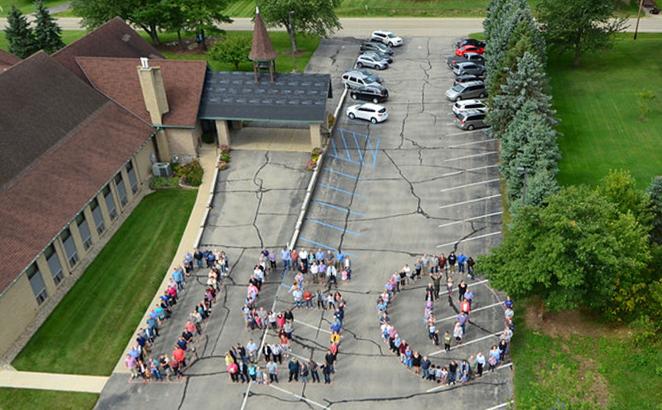 The Saugatuck Fire Department assisted in capturing an aerial photo Aug. 18, 2019, of people in formation in the parking lot of East Saugatuck CRC.